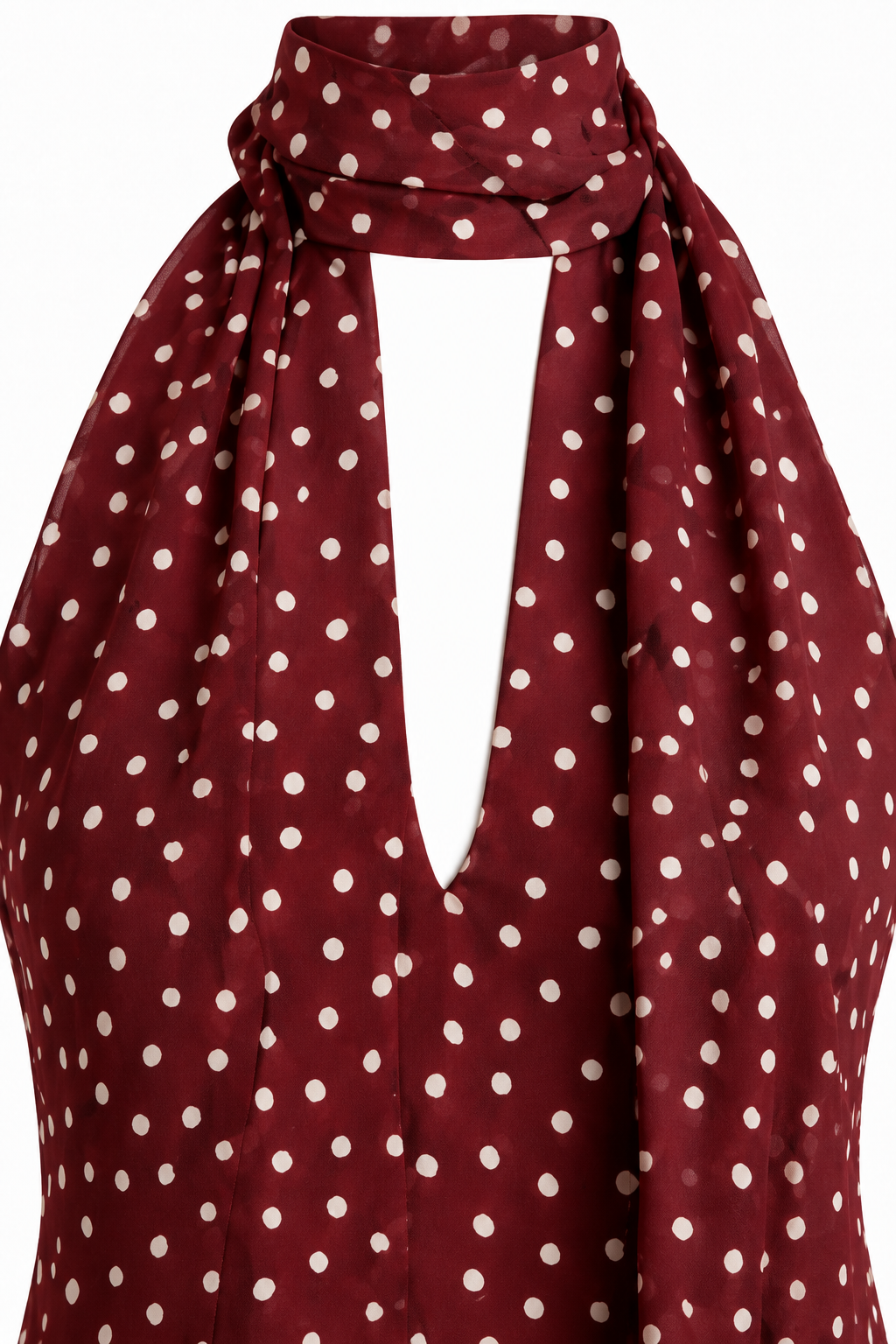 Detalle del cuello halter con lazada y del tejido burdeos de lunares del vestido Giulia